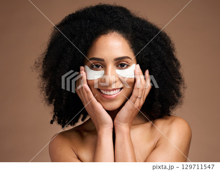 Beauty, skincare and eye mask with face of black woman for facial, product and spa treatment. Collagen, self care and luxury with girl model and eye patches for wellness, cosmetics and dermatology Beauty, skincare and eye mask with face of black woman for facial, product and spa treatment. Collagen, self care and luxury with girl model and eye patches for wellness, cosmetics and dermatology 129711547