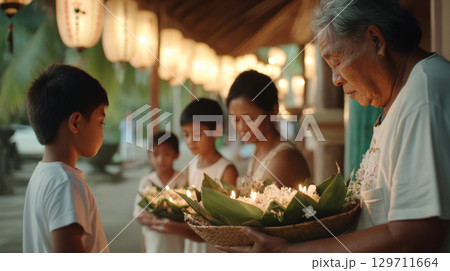 Celebrating Loy Krathong Thai family with children preparing kratongs together Celebrating Loy Krathong Thai family with children preparing kratongs together 129711664