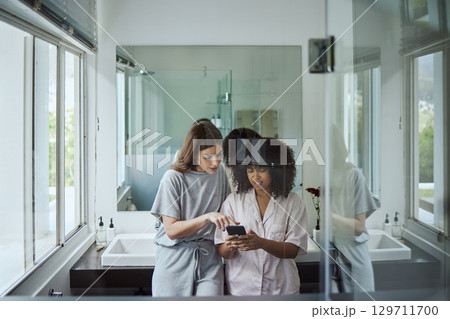 Search, phone or women friends in bathroom for social media, website or internet blog content fake news review. Tech, social network or girl on smartphone for networking, communication or media app 129711700