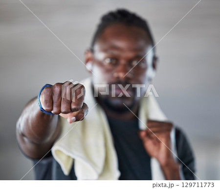 Fist, boxer and martial arts with black man and fitness, sports and boxing with exercise and hand zoom. Athlete, wellness and MMA fighter with towel, workout and training with sport motivation Fist, boxer and martial arts with black man and fitness, sports and boxing with exercise and hand zoom. Athlete, wellness and MMA fighter with towel, workout and training with sport motivation 129711773