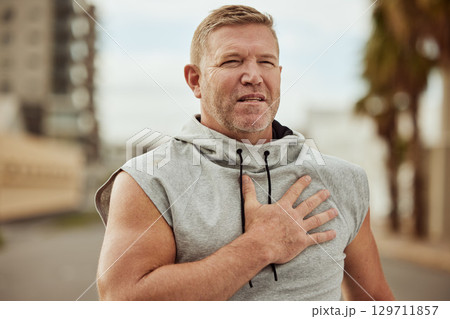 Face, fitness and man with heart attack in city after running, workout or training accident. Sports, cardio health and mature male runner with chest pain, cardiac arrest or injury, angina or stroke. Face, fitness and man with heart attack in city after running, workout or training accident. Sports, cardio health and mature male runner with chest pain, cardiac arrest or injury, angina or stroke. 129711857