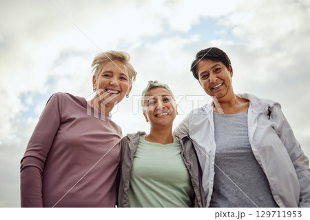 Senior women, portrait and exercise group for fitness, workout or team on mockup sky background. Low angle, elderly female face and sports friends in support of wellness, healthy retirement and smile Senior women, portrait and exercise group for fitness, workout or team on mockup sky background. Low angle, elderly female face and sports friends in support of wellness, healthy retirement and smile 129711953