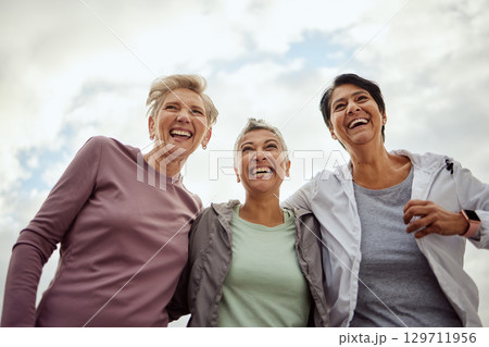 Diversity, happy women and laughing for sports, fitness and support on mockup sky background. Low angle, senior female group and exercise friends excited for community wellness, freedom or motivation Diversity, happy women and laughing for sports, fitness and support on mockup sky background. Low angle, senior female group and exercise friends excited for community wellness, freedom or motivation 129711956
