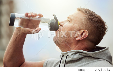 Fitness, runner or man drinking water with sports performance goals resting or relaxing on break. Healthy, tired or thirsty athlete drinks natural liquid in cardio workout, training or body exercise Fitness, runner or man drinking water with sports performance goals resting or relaxing on break. Healthy, tired or thirsty athlete drinks natural liquid in cardio workout, training or body exercise 129712013