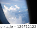 Scenic Cloudscape View from Airplane Window 129712122