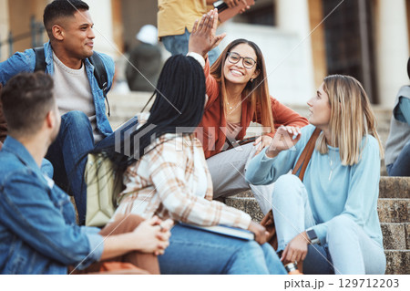 Talking, students or high five on university stairs, college campus bleachers or school steps for education diversity success. Smile, happy friends or partnership gesture in learning goals or target 129712203