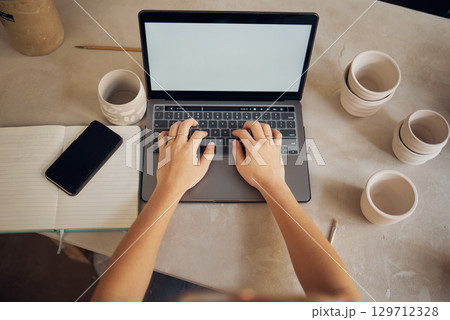 Mockup screen, pottery and hands on laptop for marketing communication, email and creative small business. Above, media and woman typing on a computer with advertising space at an art workshop Mockup screen, pottery and hands on laptop for marketing communication, email and creative small business. Above, media and woman typing on a computer with advertising space at an art workshop 129712328