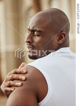 Black man, shoulder pain and runner fitness emergency, training workout accident and runner wellness. African athlete man, face and arm injury for sports run, cardio exercise and hurt muscle tension 129712430