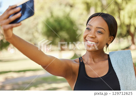 Fitness, phone selfie and black woman in park for workout, exercise and healthy lifestyle. Happy female, sports influencer and athlete taking mobile photograph for social media, wellness and goals 129712625