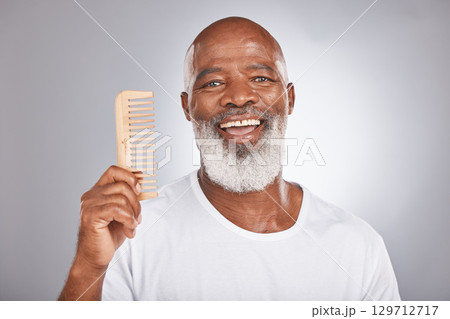 Senior black man with smile, comb and body hair, beauty and grooming with hygiene and cosmetic care against studio background. Hair care mockup, beard with portrait and face treatment and cosmetics Senior black man with smile, comb and body hair, beauty and grooming with hygiene and cosmetic care against studio background. Hair care mockup, beard with portrait and face treatment and cosmetics 129712717