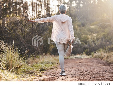 Fitness, forest or senior woman stretching in nature to start training, exercise or hiking workout in New Zealand. Back view, balance or healthy elderly person with focus, body goals or motivation Fitness, forest or senior woman stretching in nature to start training, exercise or hiking workout in New Zealand. Back view, balance or healthy elderly person with focus, body goals or motivation 129712954