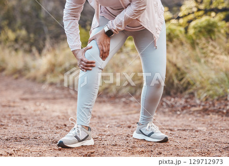 Sports, knee pain and woman in park after running, exercise and marathon training for healthy lifestyle. Wellness, fitness and hands of female athlete with muscle strain, leg injury and accident Sports, knee pain and woman in park after running, exercise and marathon training for healthy lifestyle. Wellness, fitness and hands of female athlete with muscle strain, leg injury and accident 129712973