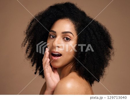 Face, beauty and black woman with skincare secret in studio on a brown background. Makeup cosmetics, portrait and young female model with glowing, healthy and flawless skin after spa facial treatment 129713040