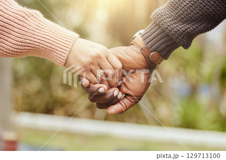 Love, support and trust hands of black couple in marriage together with care, romance and unity. Soulmate, married and man with woman holding hands for romantic bonding moment in nature zoom. Love, support and trust hands of black couple in marriage together with care, romance and unity. Soulmate, married and man with woman holding hands for romantic bonding moment in nature zoom. 129713100