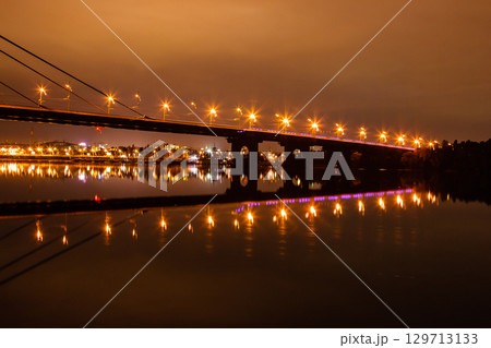 night city with reflection of houses in the river 129713133