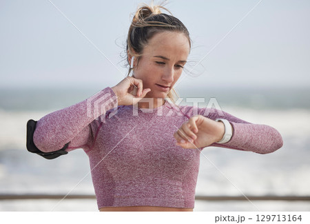 Young woman, fitness and heart rate on neck pulse for nature training. Sports runner, athlete and girl check smart watch, health progress or exercise time to monitor workout progress, energy and body 129713164