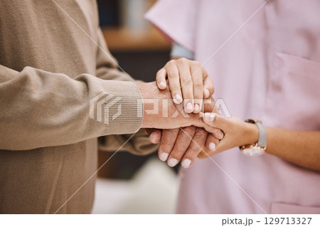 Healthcare nurse, senior patient and holding hands for medical support, assistance or wellness in retirement home. Doctor, caregiver hand solidarity and elderly care, trust, gratitude or senior care Healthcare nurse, senior patient and holding hands for medical support, assistance or wellness in retirement home. Doctor, caregiver hand solidarity and elderly care, trust, gratitude or senior care 129713327
