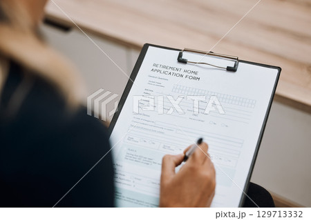 Retirement home, application form or hand of woman writing personal information to register on paper or clipboard. Contract, compliance or person signing on registration paperwork or legal documents 129713332