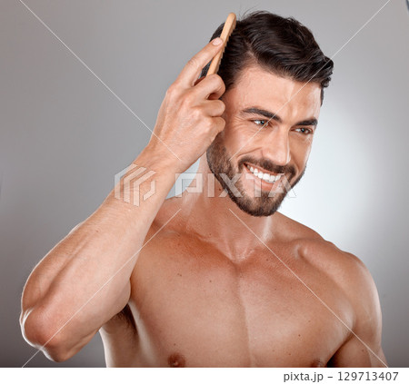 Comb, beauty or man brushing hair in grooming advertising or marketing salon hair care products. Happy, studio background or healthy male model smiles with cool hairstyle in morning routine treatment Comb, beauty or man brushing hair in grooming advertising or marketing salon hair care products. Happy, studio background or healthy male model smiles with cool hairstyle in morning routine treatment 129713407