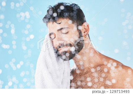 Man, towel with cleaning face and beauty, bokeh overlay with hygiene and grooming against blue background. Skincare mockup with shower, clean cosmetic care and cotton fabric, facial and wellness Man, towel with cleaning face and beauty, bokeh overlay with hygiene and grooming against blue background. Skincare mockup with shower, clean cosmetic care and cotton fabric, facial and wellness 129713493