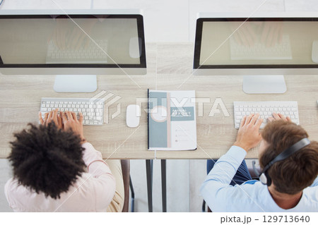 Telemarketing, contact us or employees in a call center consulting, talking or speaking of financial loan services. Computer screen, top view or sales people networking at customer support help desk 129713640