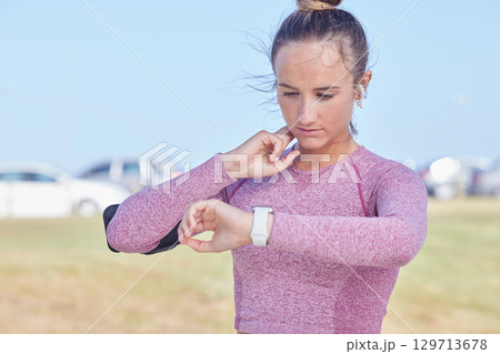 Exercise, woman and smartwatch for pulse check, training and fitness outdoor for wellness. Female athlete, girl or watch for tracking heart rate, workout or healthcare for body care, sports or cardio 129713678