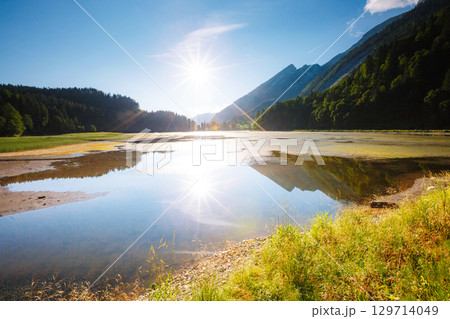 A look at the pond Obersee in the sunlight. Scenic wealth of Swiss alps. A look at the pond Obersee in the sunlight. Scenic wealth of Swiss alps. 129714049