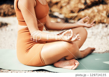 Beach meditation yoga, peace and woman meditate for chakra energy healing of soul, aura or spiritual balance. Zen freedom, pilates and girl relax for mental health, mindset wellness or mindfulness 129714135