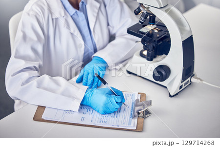 Research, clipboard and scientist writing, checklist and schedule form in laboratory. Science, researchers and make notes for data analysis, sample test and innovation for healthcare and medical cure Research, clipboard and scientist writing, checklist and schedule form in laboratory. Science, researchers and make notes for data analysis, sample test and innovation for healthcare and medical cure 129714268