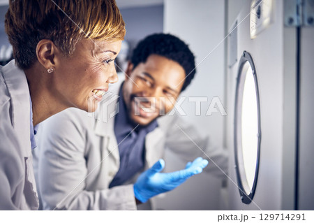 Science, man and woman in laboratory, research and test sample for cure, vaccine or conversation. Researchers, scientist or staff talking, data analysist and check experiment for innovation or expert Science, man and woman in laboratory, research and test sample for cure, vaccine or conversation. Researchers, scientist or staff talking, data analysist and check experiment for innovation or expert 129714291