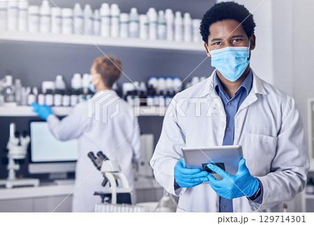 Portrait, science and black man with mask, tablet and laboratory for vaccine, cure or healthcare. Medical professional, face cover or Nigerian male in lab, diagnosis for virus, innovation or research Portrait, science and black man with mask, tablet and laboratory for vaccine, cure or healthcare. Medical professional, face cover or Nigerian male in lab, diagnosis for virus, innovation or research 129714301
