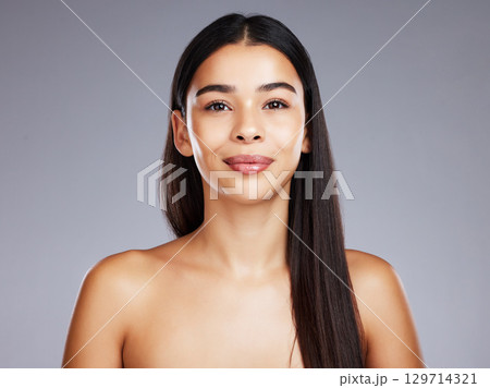 Portrait, skincare and woman with cosmetics, beauty and organic facial on grey studio background. Makeup, Latino female and girl with luxury, soft and clear skin for treatment, grooming and mock up. 129714321
