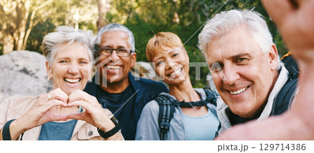 Nature, selfie and senior friends hiking together in a forest while on an outdoor adventure. Happy, smile and portrait of a group of elderly people trekking in woods for wellness, health and exercise Nature, selfie and senior friends hiking together in a forest while on an outdoor adventure. Happy, smile and portrait of a group of elderly people trekking in woods for wellness, health and exercise 129714386