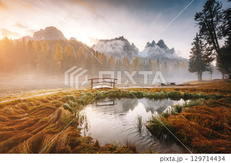 Stunning image of the foggy lake Antorno in National Park Tre Cime di Lavaredo. Stunning image of the foggy lake Antorno in National Park Tre Cime di Lavaredo. 129714434