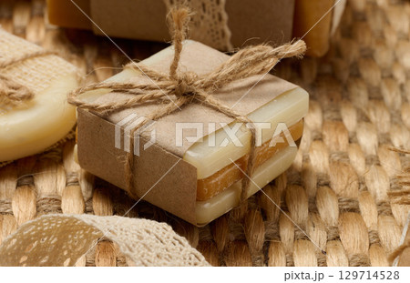 Handmade soap bars on marble stand, close up 129714528