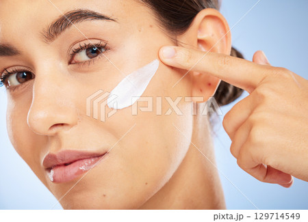 Portrait, skincare and moisturizer with a model woman in studio on a gray background for antiaging beauty. Face, lotion and product with an attractive young female inside to apply facial treatment Portrait, skincare and moisturizer with a model woman in studio on a gray background for antiaging beauty. Face, lotion and product with an attractive young female inside to apply facial treatment 129714549