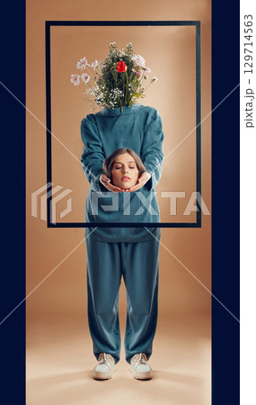 Woman, fashion or abstract art with flowers on studio background, picture frame or manipulation photography. Beauty model, faceless head or plant bouquet in freedom empowerment or creative aesthetic Woman, fashion or abstract art with flowers on studio background, picture frame or manipulation photography. Beauty model, faceless head or plant bouquet in freedom empowerment or creative aesthetic 129714563