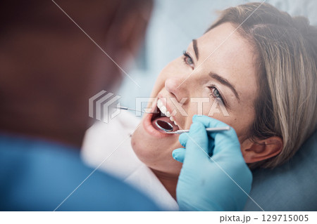 Teeth, dental or woman at a dentist for surgery, teeth whitening or mouth cleaning for gum disease bacteria. Wellness, tooth decay or hands helping or working with oral tools in healthcare clinic 129715005