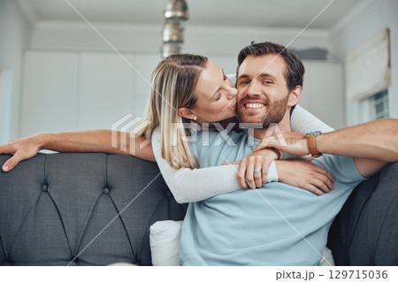 Love, couple and sofa kiss portrait in home for care, gratitude and intimate moment in home. Happy people in marriage bonding together in living room with romantic embrace with hug and smile. 129715036