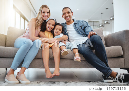 Interracial, portrait and family on sofa, love and bonding on weekend, break and smile together. Multiracial, man and woman with daughters, kids and in living room for quality time, happy and couch. Interracial, portrait and family on sofa, love and bonding on weekend, break and smile together. Multiracial, man and woman with daughters, kids and in living room for quality time, happy and couch. 129715126