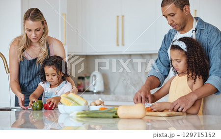 Cooking, family and kitchen learning of a girl with mother and dad with love and parent support. Interracial, teaching and vegetables in a house with children and parents making health and diet food Cooking, family and kitchen learning of a girl with mother and dad with love and parent support. Interracial, teaching and vegetables in a house with children and parents making health and diet food 129715152