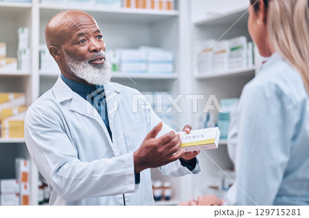 Healthcare, pharmacist and man at counter, medicine, prescription drugs and happy service at drug store. Health, wellness and medical insurance, black man and woman at pharmacy for advice and pills. Healthcare, pharmacist and man at counter, medicine, prescription drugs and happy service at drug store. Health, wellness and medical insurance, black man and woman at pharmacy for advice and pills. 129715281