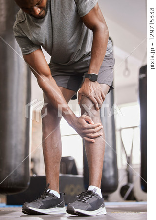 Fitness, knee pain and injury of man in gym with muscle accident, medical emergency and first aid risk after exercise training. Joint pain, legs and bone health from sports workout, wound and problem Fitness, knee pain and injury of man in gym with muscle accident, medical emergency and first aid risk after exercise training. Joint pain, legs and bone health from sports workout, wound and problem 129715338