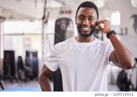 Portrait of black man, personal trainer at gym and workout athlete ready for fitness exercise, healthy body and a wellness training. Face of strength, muscle development and a physical health coach Portrait of black man, personal trainer at gym and workout athlete ready for fitness exercise, healthy body and a wellness training. Face of strength, muscle development and a physical health coach 129715411