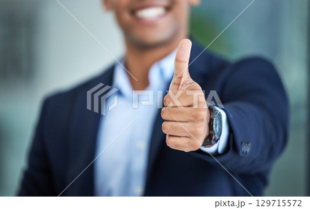 Thumbs up, success and hand of businessman in the office with an approval, agreement or positive gesture. Happiness, successful and professional male employee with a thank you thumbsup in workplace. 129715572