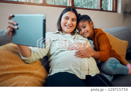 Pregnant mother, girl or tablet on video call on sofa in house or home living room in lockdown communication, social media or selfie. Smile, happy or pregnant mom and bonding child on zoom technology Pregnant mother, girl or tablet on video call on sofa in house or home living room in lockdown communication, social media or selfie. Smile, happy or pregnant mom and bonding child on zoom technology 129715759