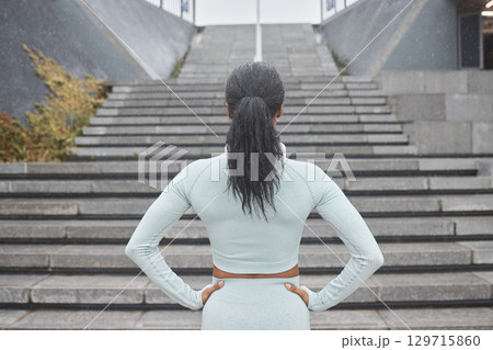 Stairs, running and black woman runner fitness ready for workout and steps training with motivation. Back view of a woman before wellness exercise, sports and athlete challenge for a healthy body 129715860
