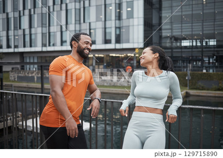 Fitness, running and couple of friends happy in the city ready for sports, workout and exercise. Runner, training and smile of athlete people together on a break for wellness, health and happiness 129715890