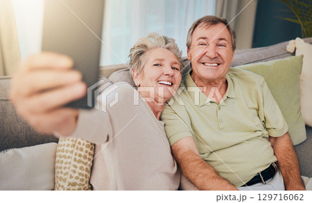 Senior selfie, crazy and couple with a phone for communication, smile and relax on the sofa during retirement. Mobile photo, funny and elderly man and woman with technology for memory on the couch Senior selfie, crazy and couple with a phone for communication, smile and relax on the sofa during retirement. Mobile photo, funny and elderly man and woman with technology for memory on the couch 129716062
