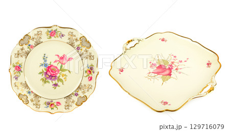 Set of Vintage plates of unusual shape with gold rim isolated on whit. Collage. Wide photo. Set of Vintage plates of unusual shape with gold rim isolated on whit. Collage. Wide photo. 129716079